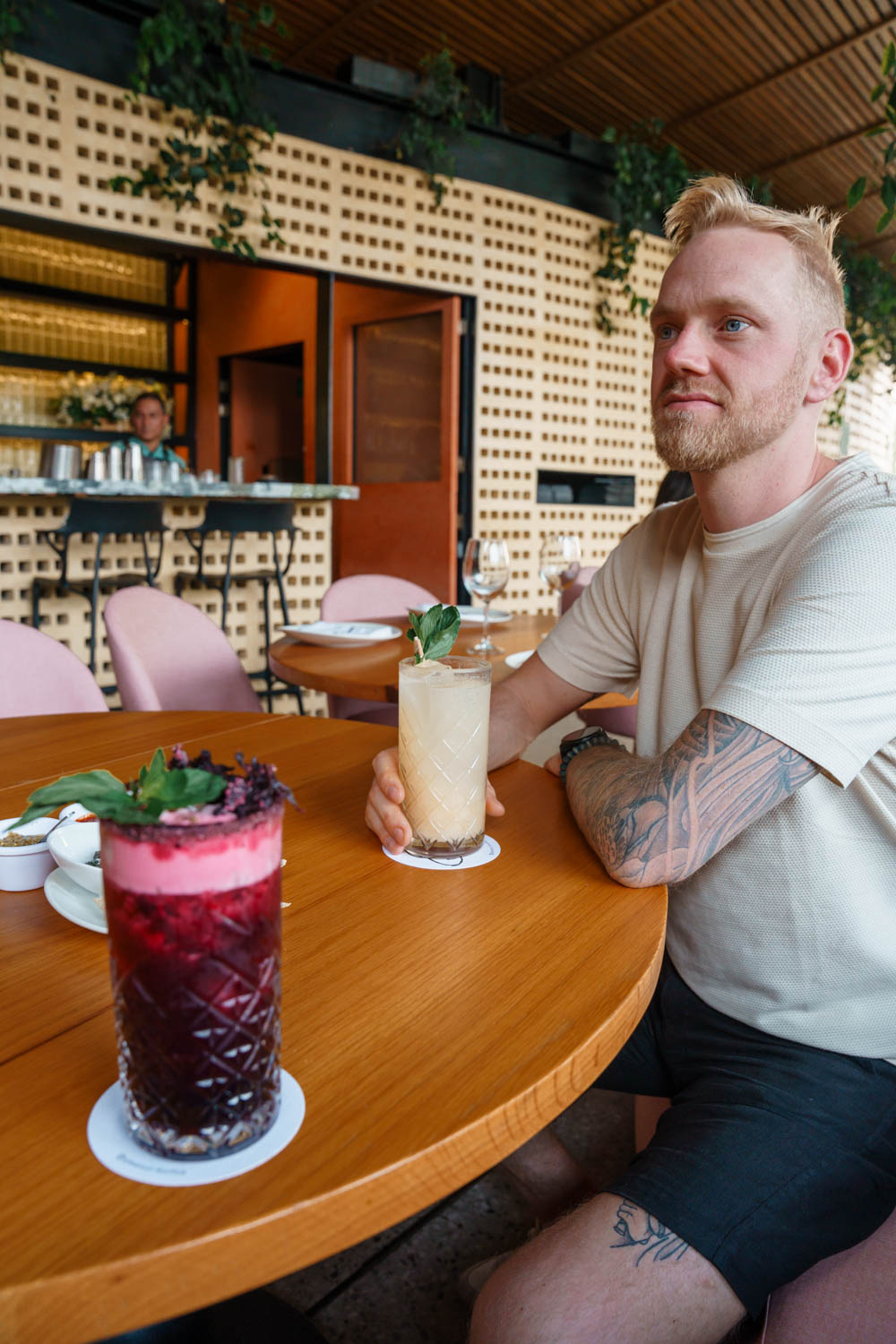 Author Robin is enjoying his cocktail at Balmori Rooftop Bar.