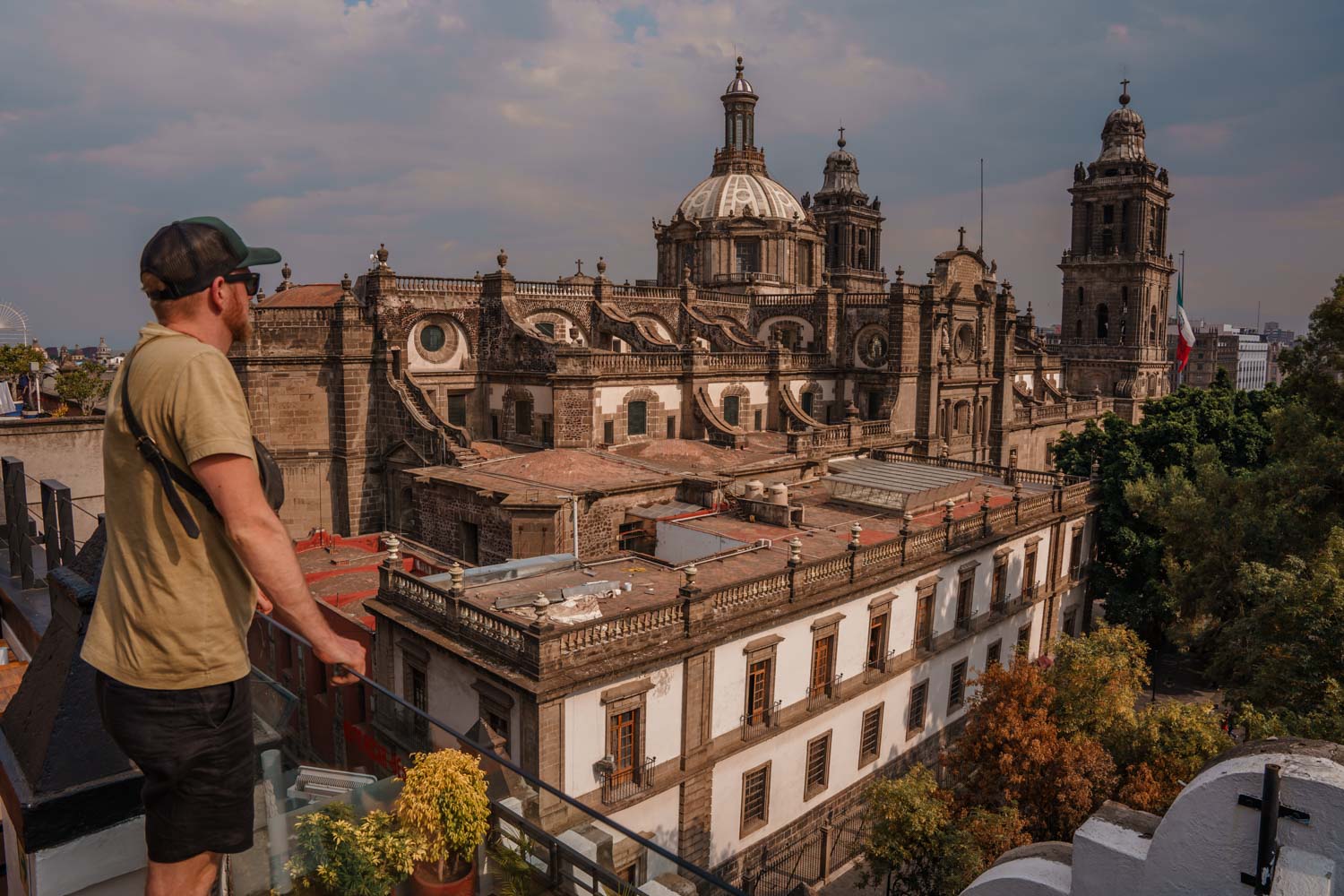 Author Robin looking at Zocalo in the Historic Neighborhood of Mexico City from a rooftop.